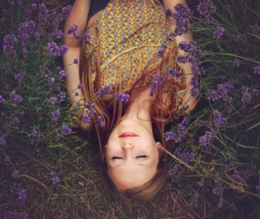 Woman lying in a field of lavender