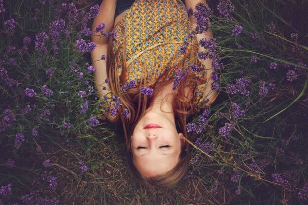 Woman lying in a field of lavender